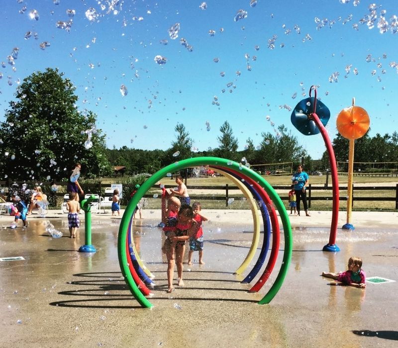 Kids running through Hawk-Island-Park-Splash-Pad