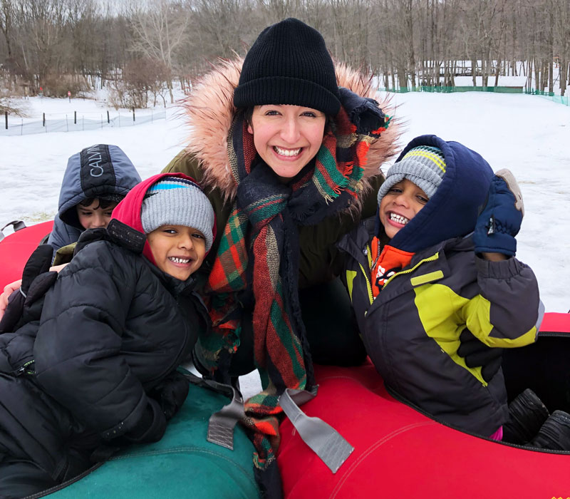 Winter-activities-kids-with-mom-sledding-at-burchfield-park-lansing