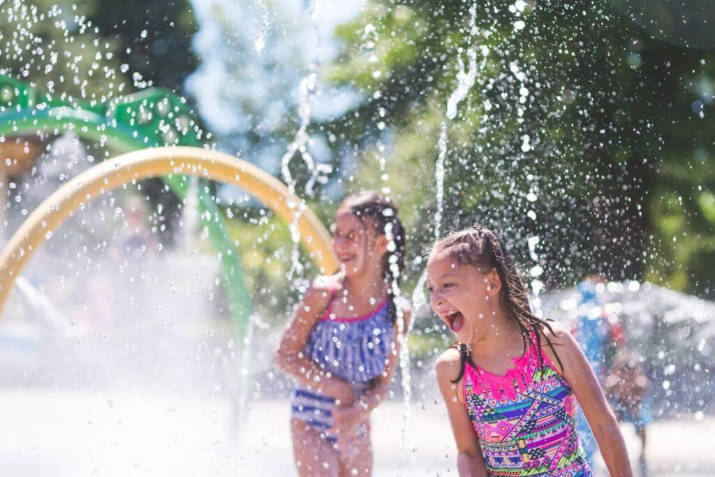 girls having fun at splash pad