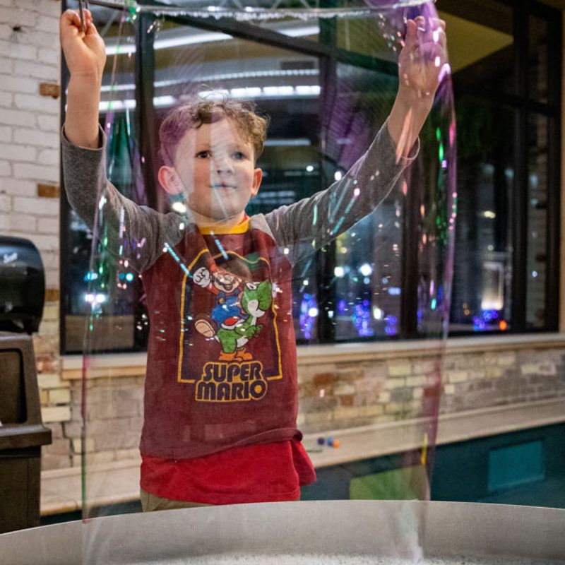 Grand Rapids Children's Museum Boy with Bubble GRK