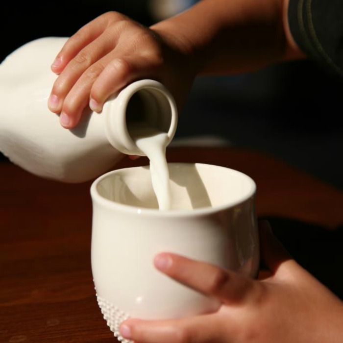 kids eat free kid pouring milk article kids eat free kid pouring milk article