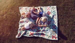 August Calendar Header Kids Summer laying outside Lansing Michigan
