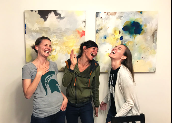 Mom-friends-laughing-together-mom-groups-Lansing