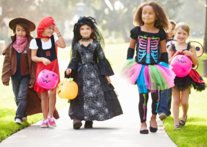 Trick-or-Treat-Times-Kids-in-Costumes-walking-down-the-street