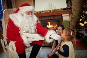 Santa Claus reading book with kids Lansing Santa
