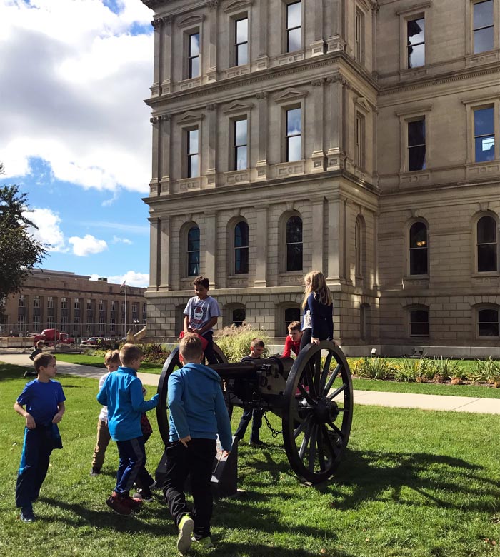 Kids-playing-outside-Michigan-State-Capitol-Downtown-Lansing
