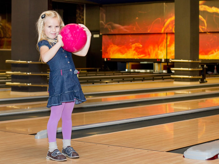 Kids-Bowl-Free-Girl-bowling-with-bowling-shoes-Lansing