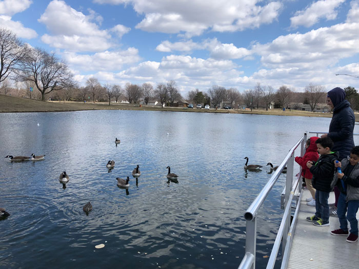 Sharp-park-boating-dock kids looking at ducks