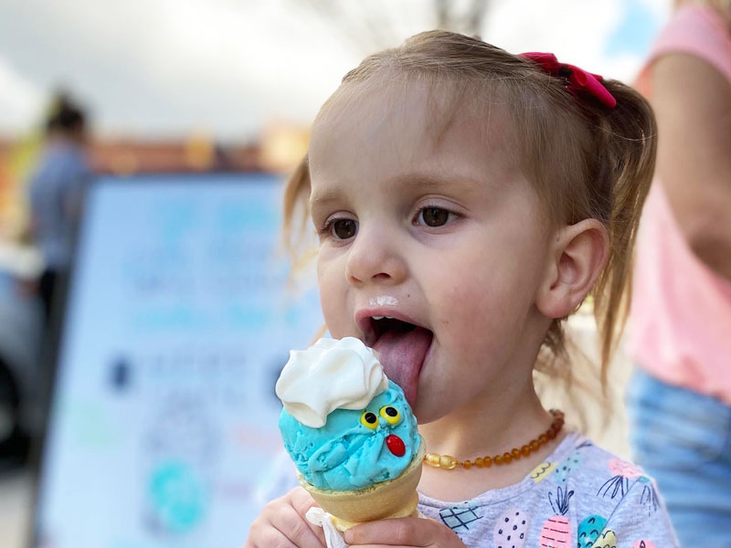 Ice-cream-shop-Mason-Lansing Michigan girl licking ice cream cone