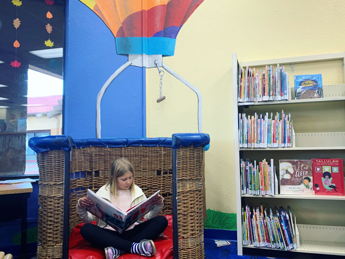 South_Lansing_Library_Hot_Air_Balloon-girl-sitting-and-reading