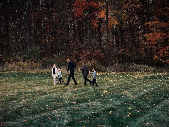 Family_Walking_by_Trees_