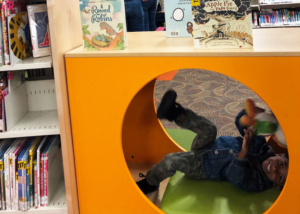 East-Lansing-Library-Story-Time-Boy-Playing-in-Reading-Nook-with-puppet