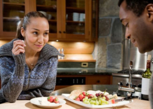 at home date night couple eating cheese and fruit