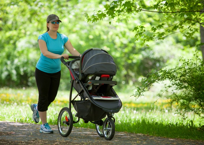 fitness woman exercising - walk with stroller