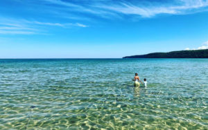 Places-to-visit-feature-mom-and-son-wading-in-pictured-rocks
